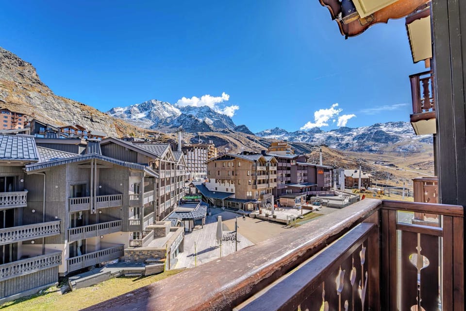 Panoramic mountain view from the balcony — stay close to lifts and the vast 3 Valleys ski area.