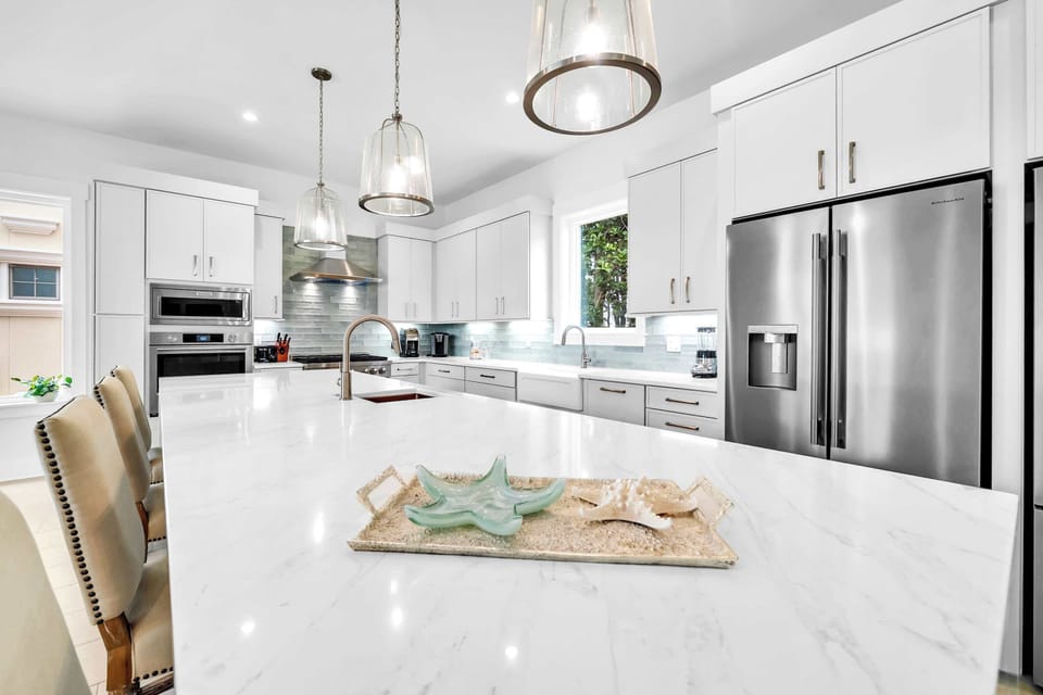 Gather at the spacious kitchen island for morning coffee, casual meals or conversations that linger long into the night. 