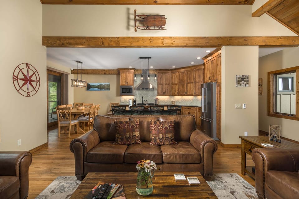 Open living room, dining area, and kitchen