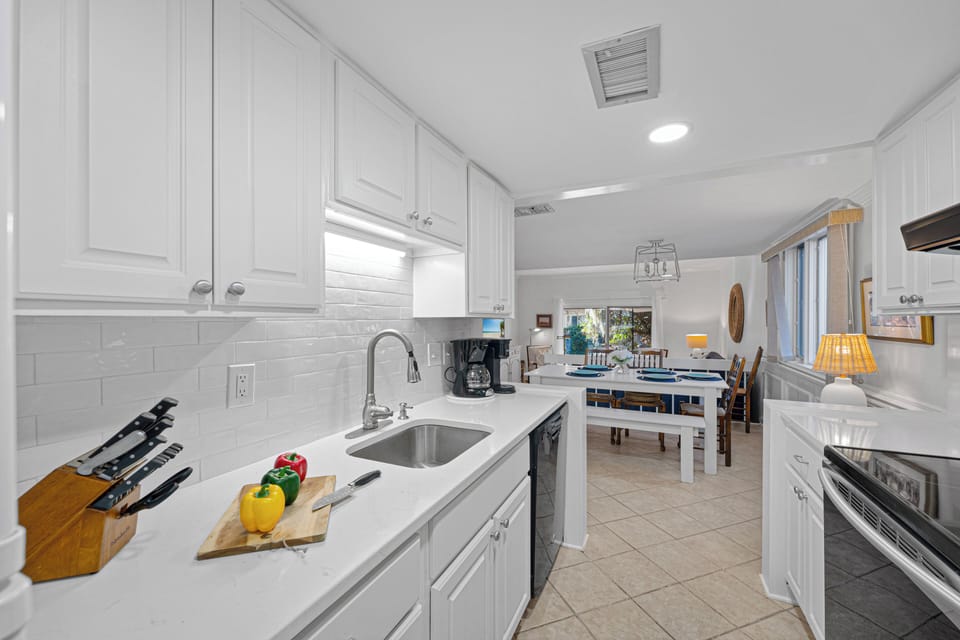 The fully equipped kitchen makes dining simple and enjoyable, whether you're preparing a full meal or quick snacks before heading out to Harbour Town.