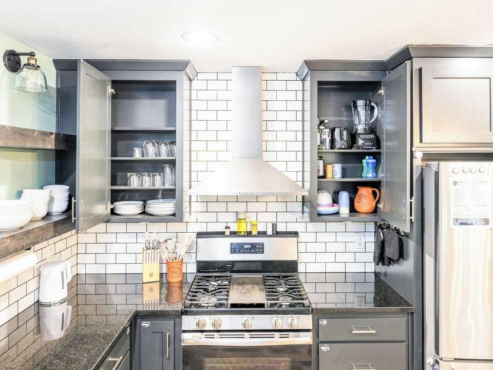 Enjoy a fully equipped kitchen stocked with cookware, dishes, glassware, and serving essentials. Extended-stay guests will appreciate the thoughtful organization and storage space.