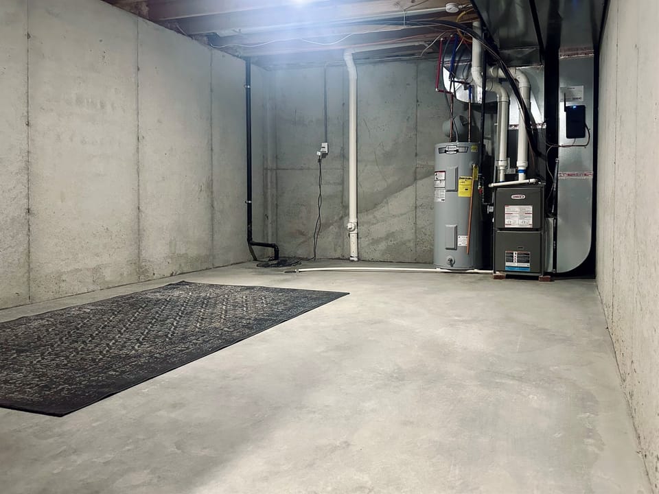 Utility side of the basement provides even more storage and functional space. A practical feature for guests staying several weeks or longer.