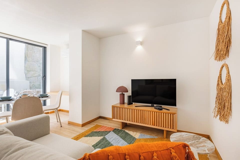 Living room with sofa-bed, TV, AC and Dining table for 4.
