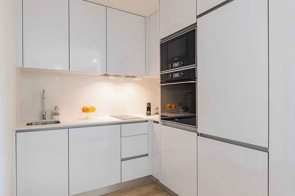 Fully equipped kitchenette with washing machine and dishwasher.