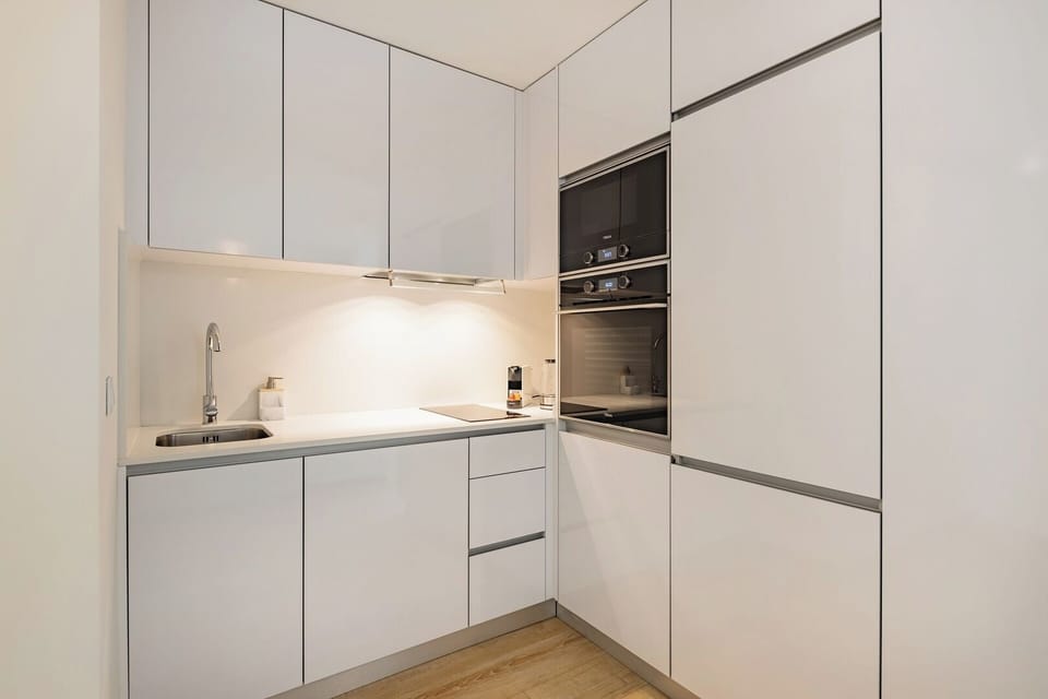 Fully equipped kitchenette with washing machine and dishwasher.
