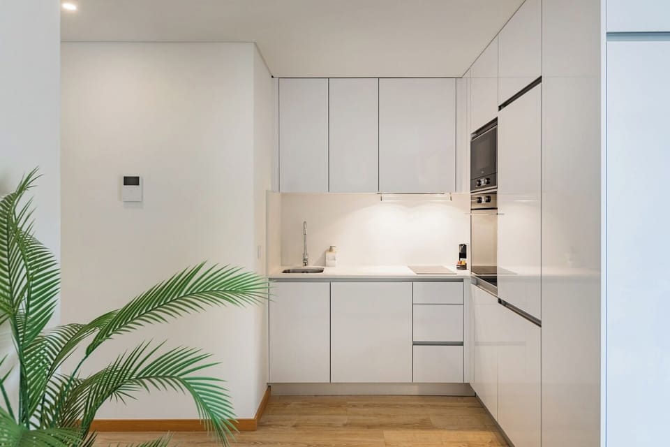 Fully equipped kitchenette with washing machine and dishwasher.