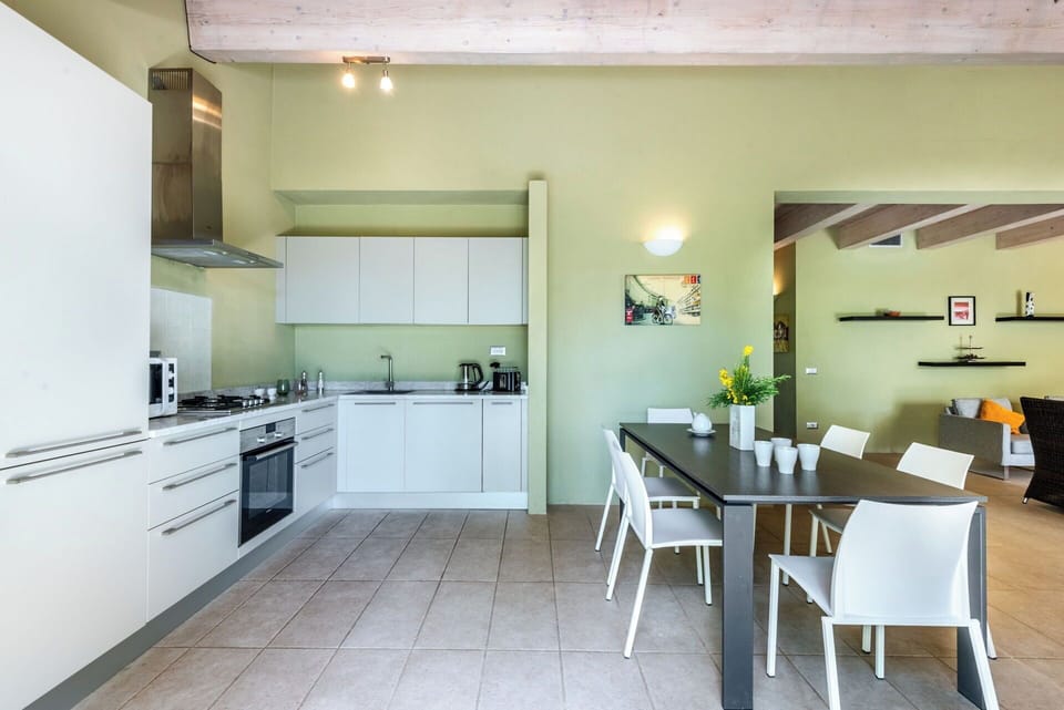 Interior Design, Furniture, Kitchen, Flooring, Ceiling, Floor, Countertop, Room, Lighting, Chair