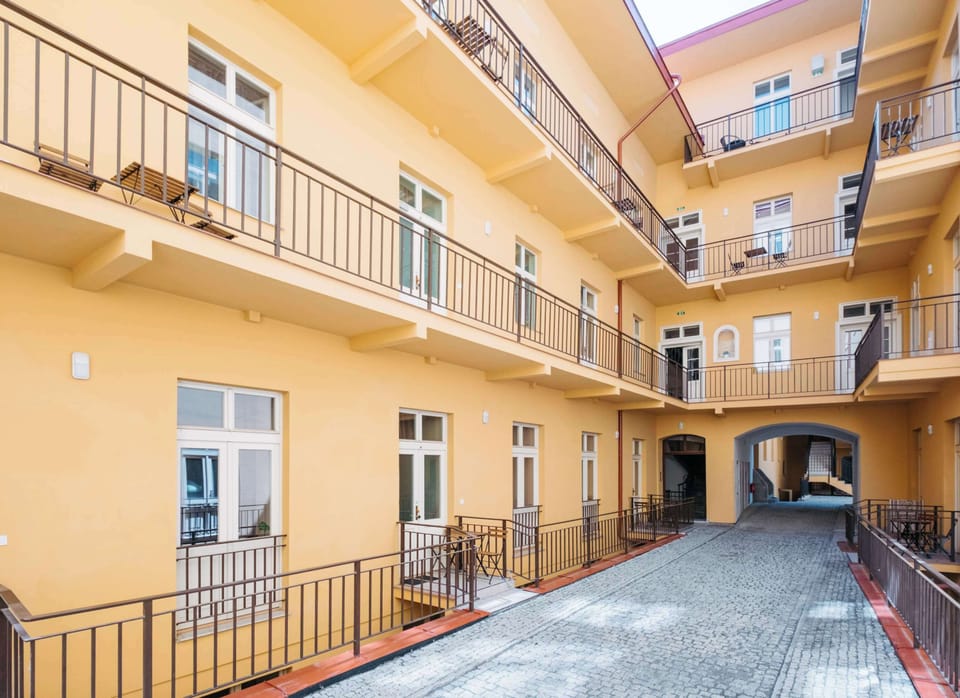 Inside of the building there is inner courtyard with a paved path