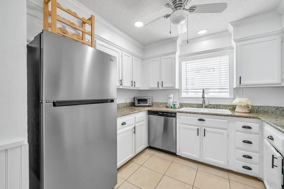 Fully applianced kitchen with stainless appliances