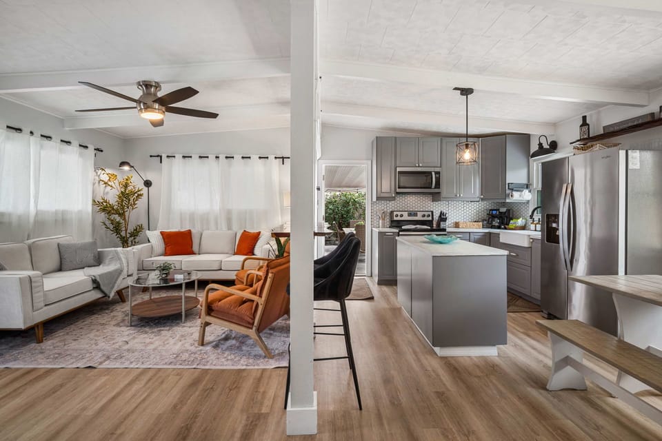 Bright, modern living space with cozy seating, warm accents, and an open layout—perfect for relaxing after a day in Tampa.
