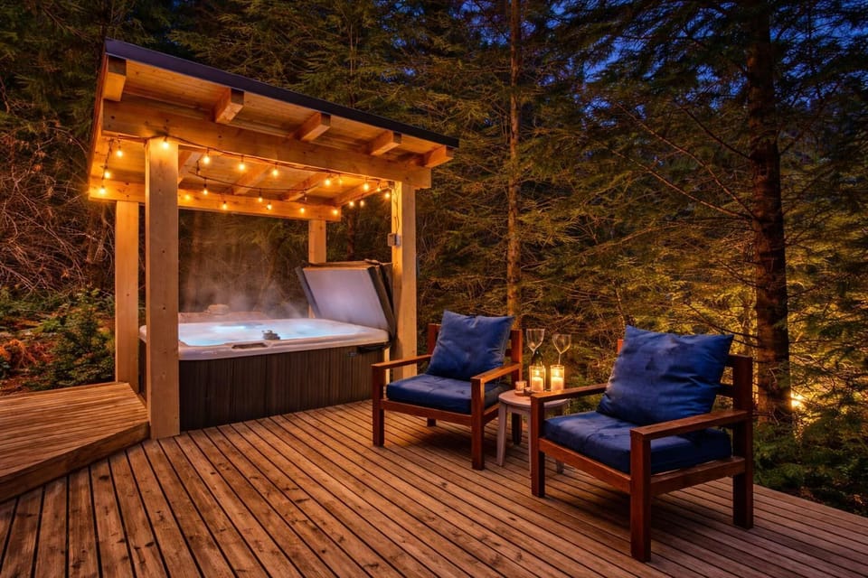 Cozy outdoor retreat with canopy bed and ambient lighting