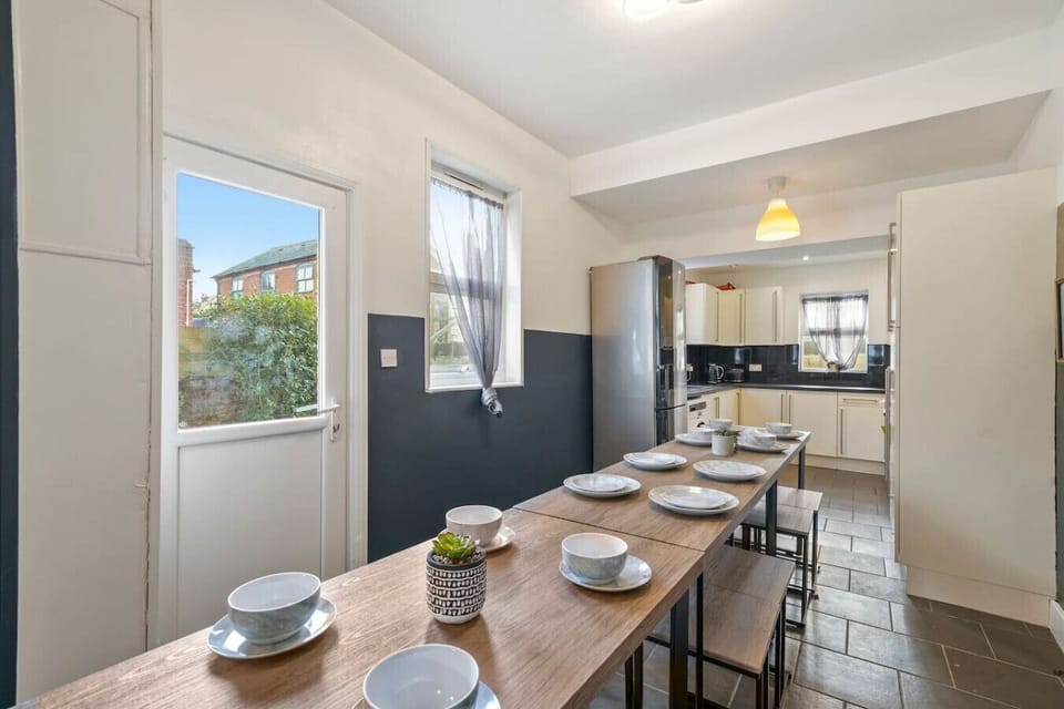 Serve up breakfast or dinner at the long dining table with plenty of seating.