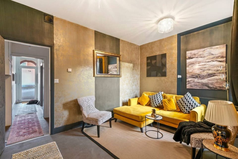 Spend time together in the spacious lounge with seating, side tables, and a hallway view.