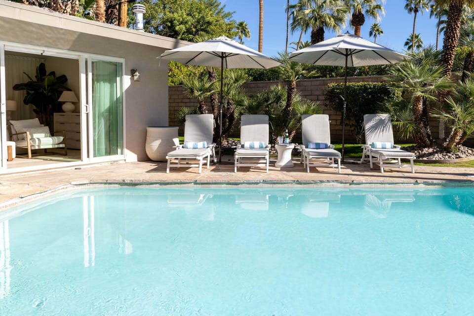 Sink into plush poolside loungers