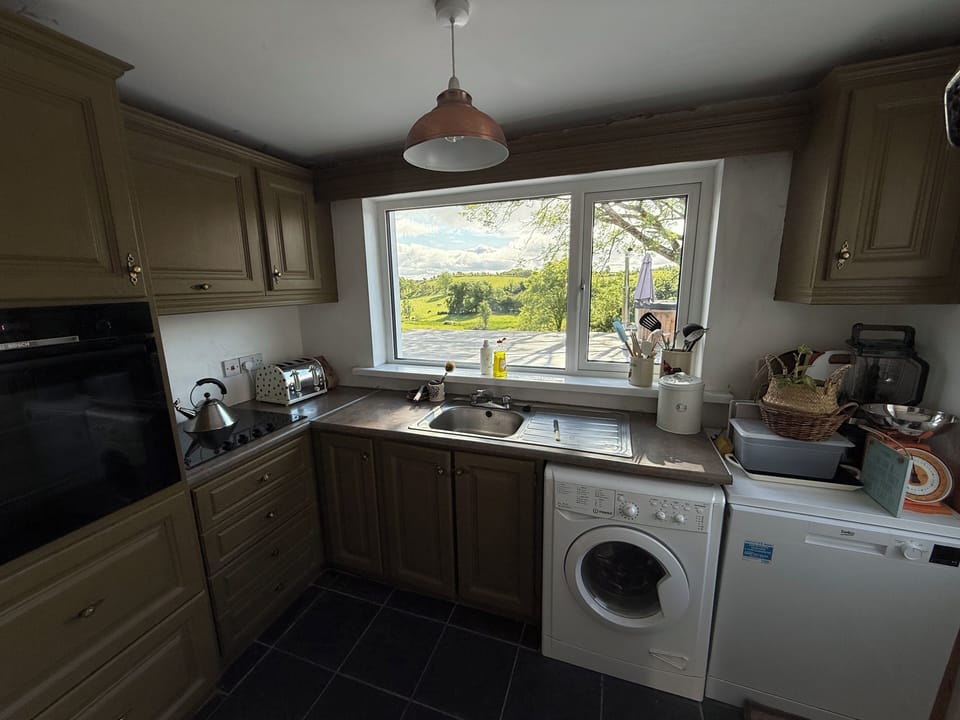 Kitchen - Electric oven, hob, washer/dryer, dishwasher.