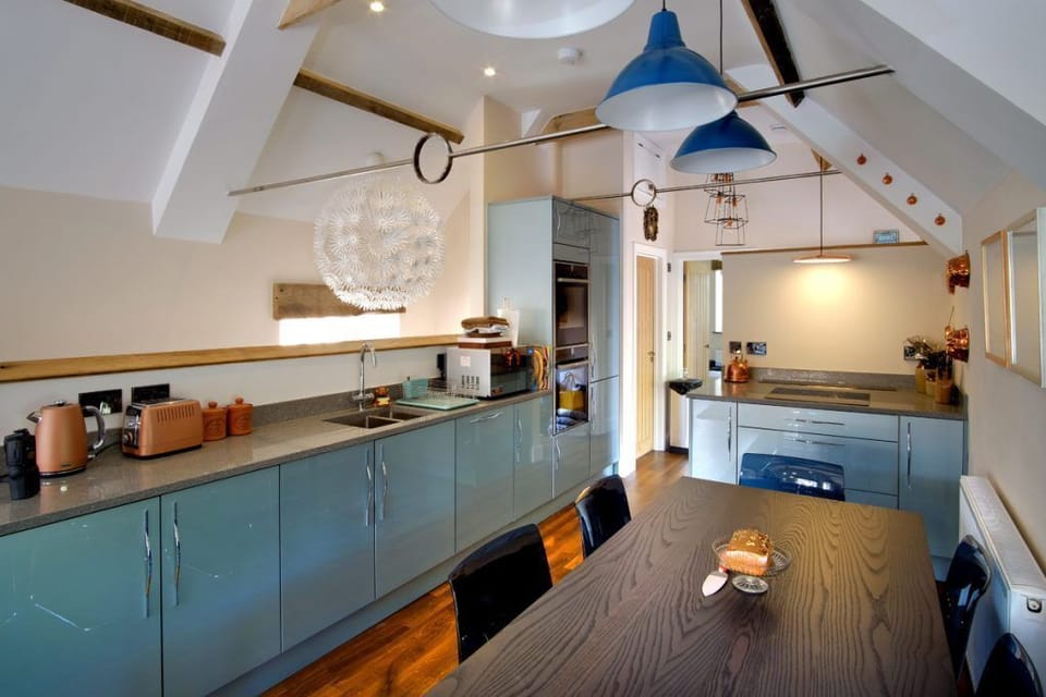 The light, airy space of the barn conversion blends beautifully with the modern, well equipped kitchen.