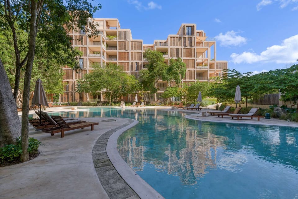 Shared pool with sun loungers 