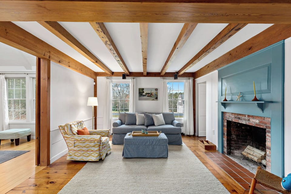 Welcome to Love and Luck, beamed living room with fireplace