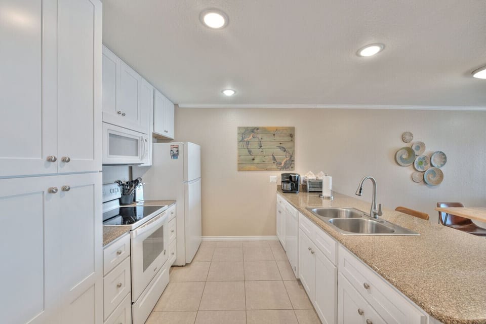 Fully equipped kitchen with ample counter space and storage