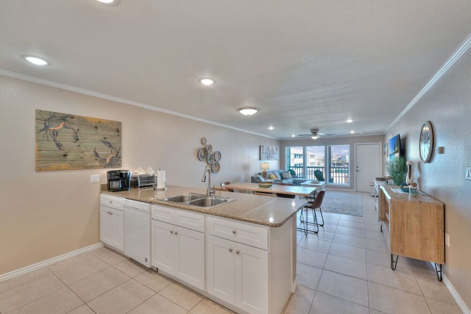 Open-concept kitchen and living area with spacious island