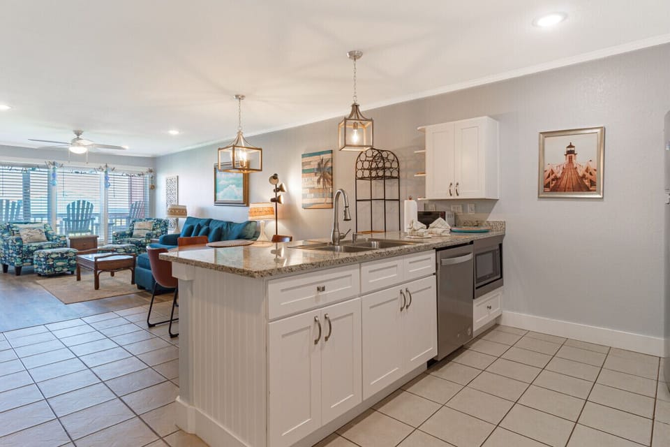 Kitchen opens to living