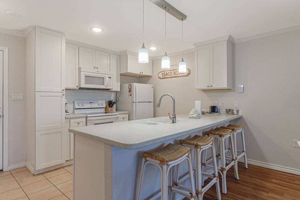 Bright kitchen with island seating and modern appliances