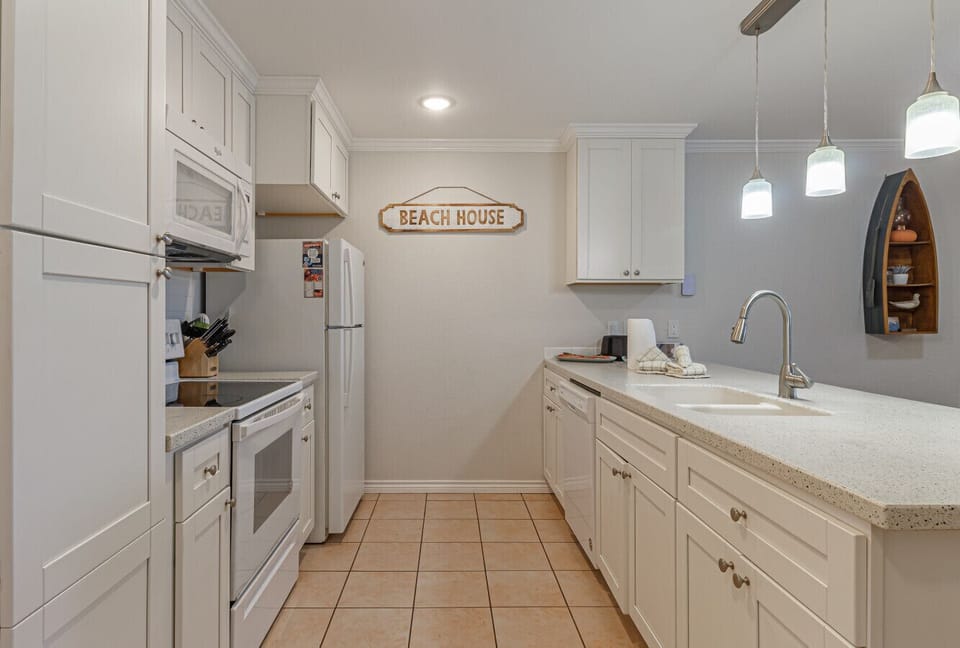 Fully equipped galley kitchen with ample storage
