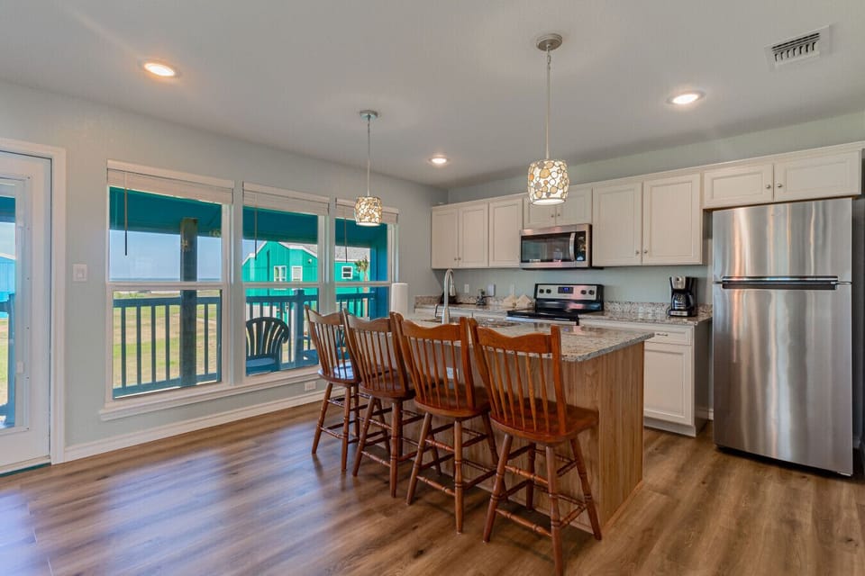 Kitchen and dining space with balcony access