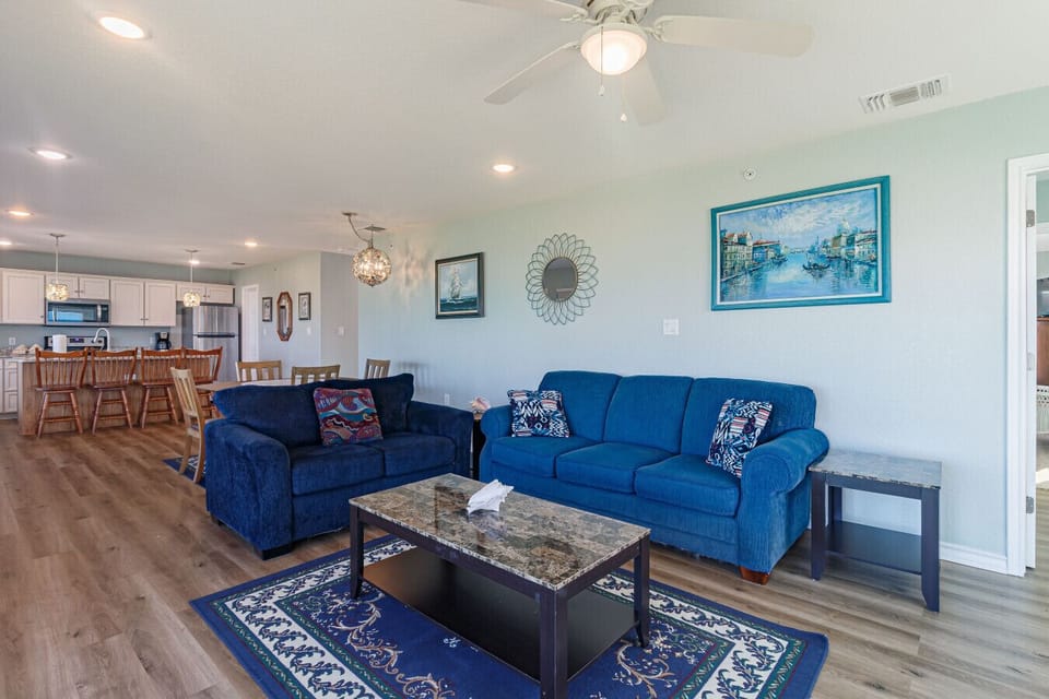 Open-concept living area with coastal décor