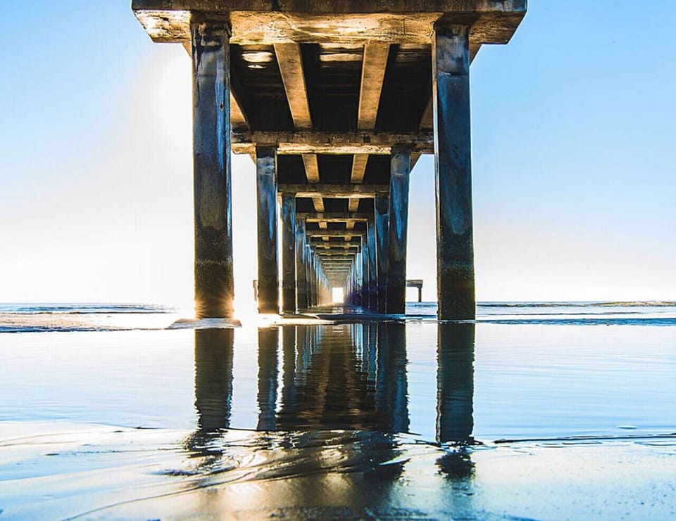 An iconic pier reaching into the sea, surrounded by sweeping beach views—ideal for fishing, sunset walks, and classic seaside moments.