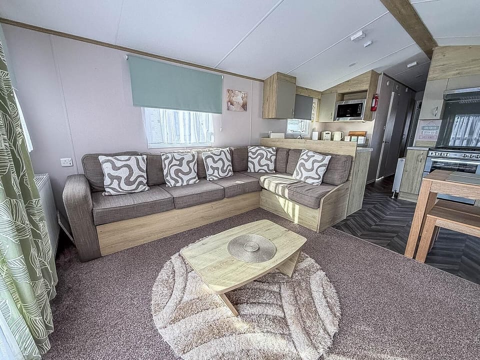 The L shaped sofa is the perfect place to cosy up and watch a movie with the whole family, or make plans for more fun during your stay.