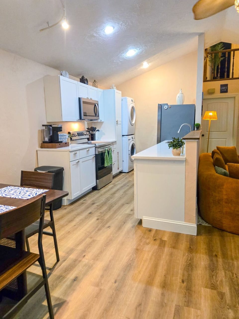 Fully stocked kitchen with front end washer and dryer