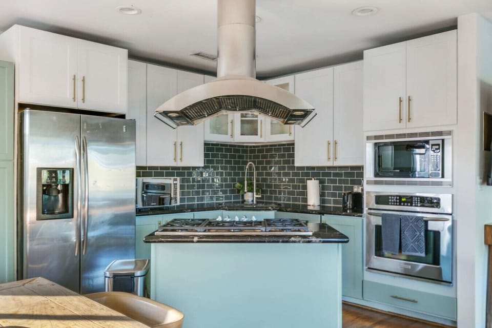Fully equipped modern kitchen with premium appliances and ample counter space.