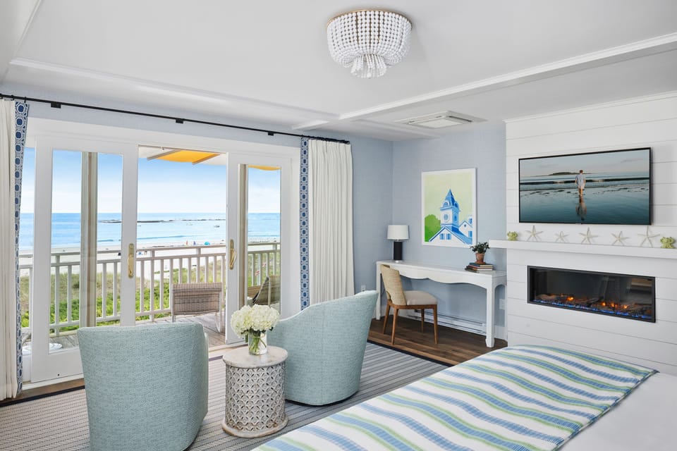 This beautifully designed bedroom features direct beach access, ocean views, and stylish furnishings for a tranquil seaside retreat.