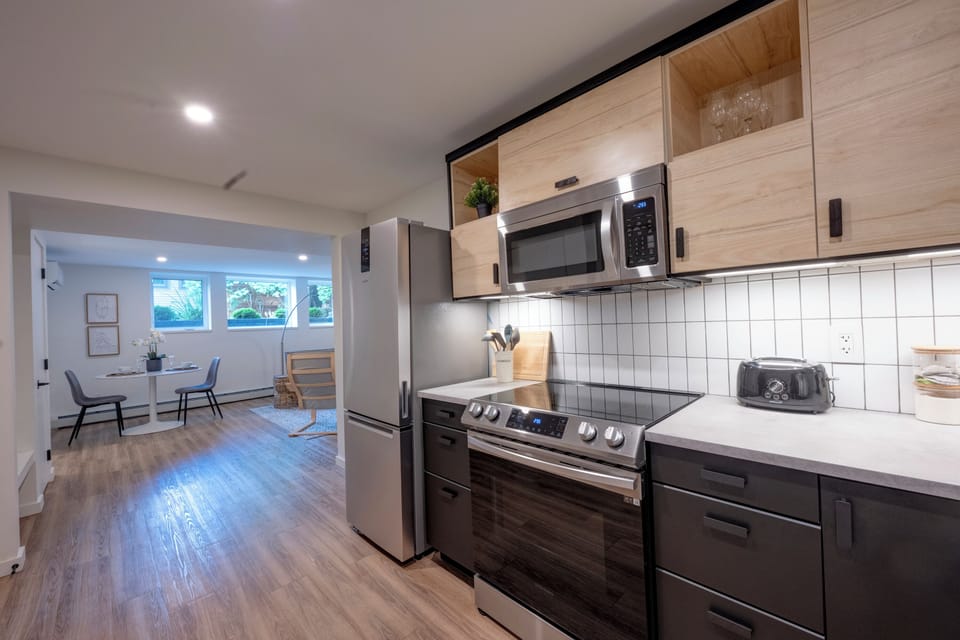 Fully equipped kitchen with modern appliances and generous counter space.