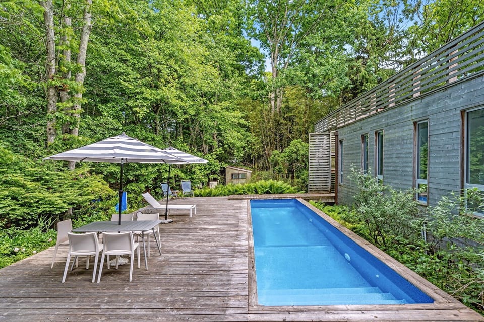 Pool deck with lounge seating and dining for six