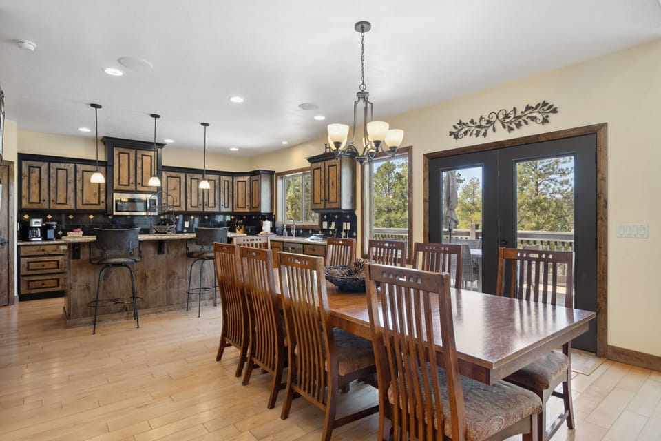 The large dining room table is the perfect spot to gather and play games or enjoy dinner.