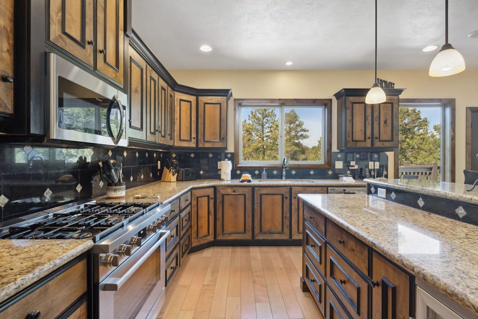 Ample counter space, luxury appliances, and beautiful finishes make this kitchen a chef's delight.