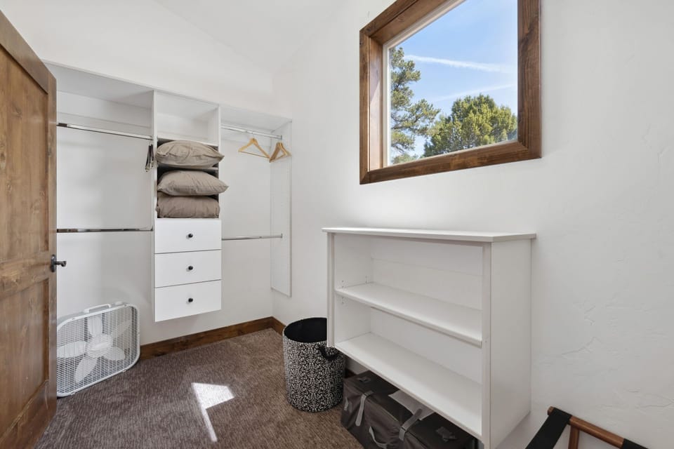 The large walk in closet in the primary suite has plenty of room for clothes and luggage storage.