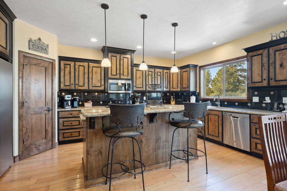 The chef's kitchen is fully appointed with top of the line appliances, cookware, and supplies.