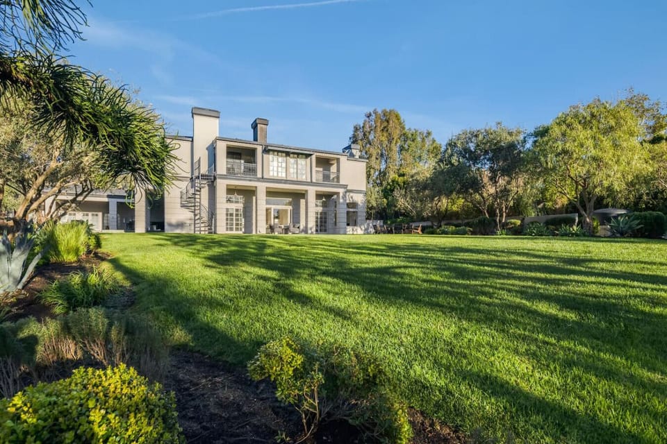 Spacious and beautifully landscaped backyard, perfect for outdoor relaxation.
