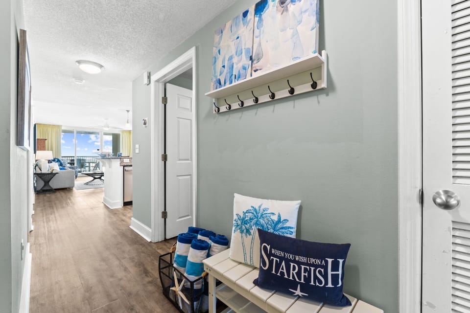 The condo is styled with fresh coastal décor that brings the beach indoors in a calm, inviting way.