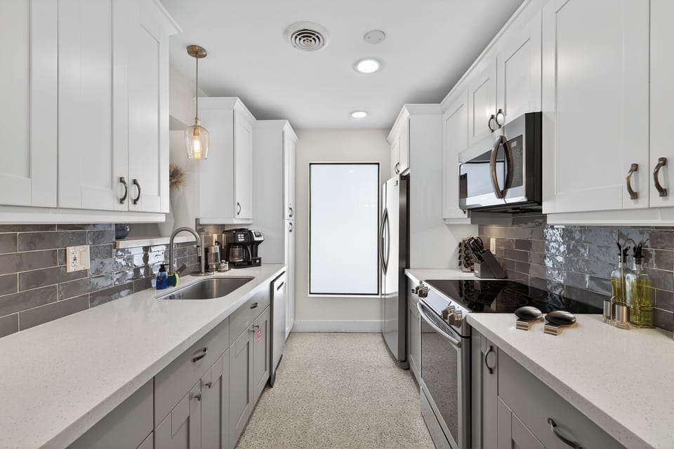 Fully equipped kitchen with modern appliances and ample counter space