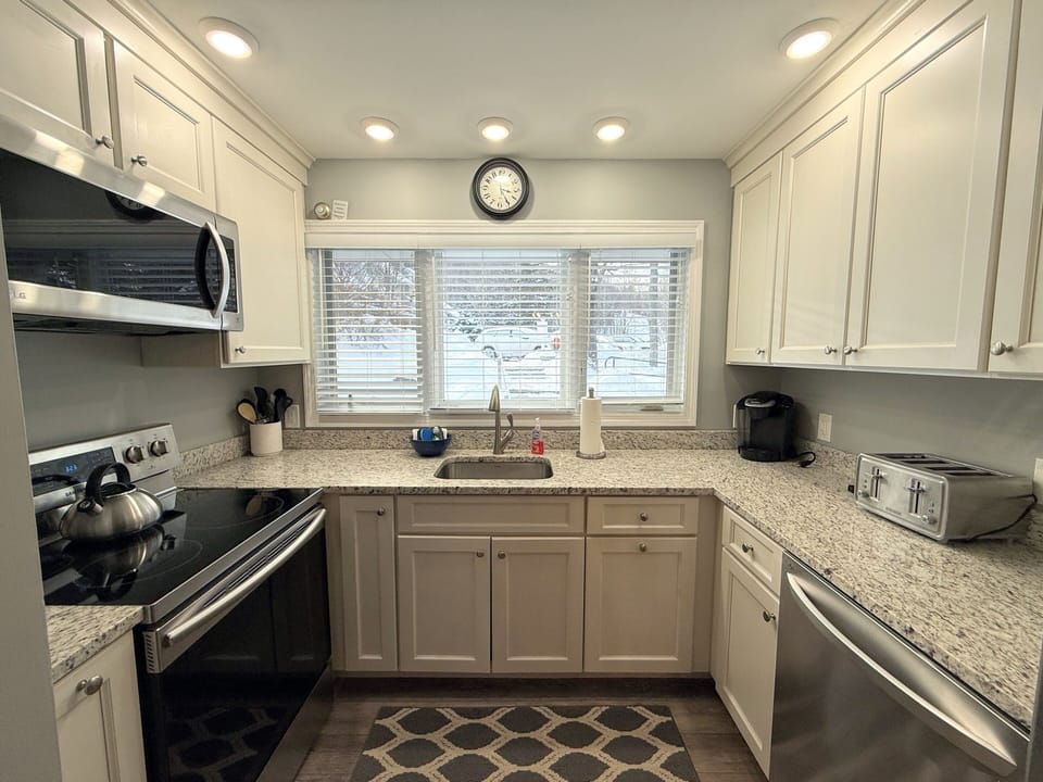 Updated Kitchen with stainless steel appliances and granite countertops.