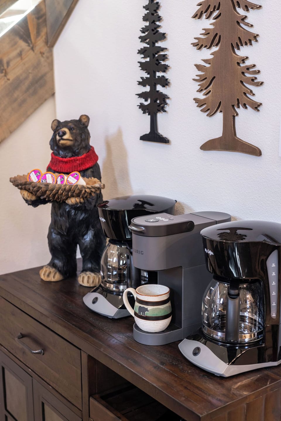 Cozy cabin-style coffee bar with multiple brew options for guests