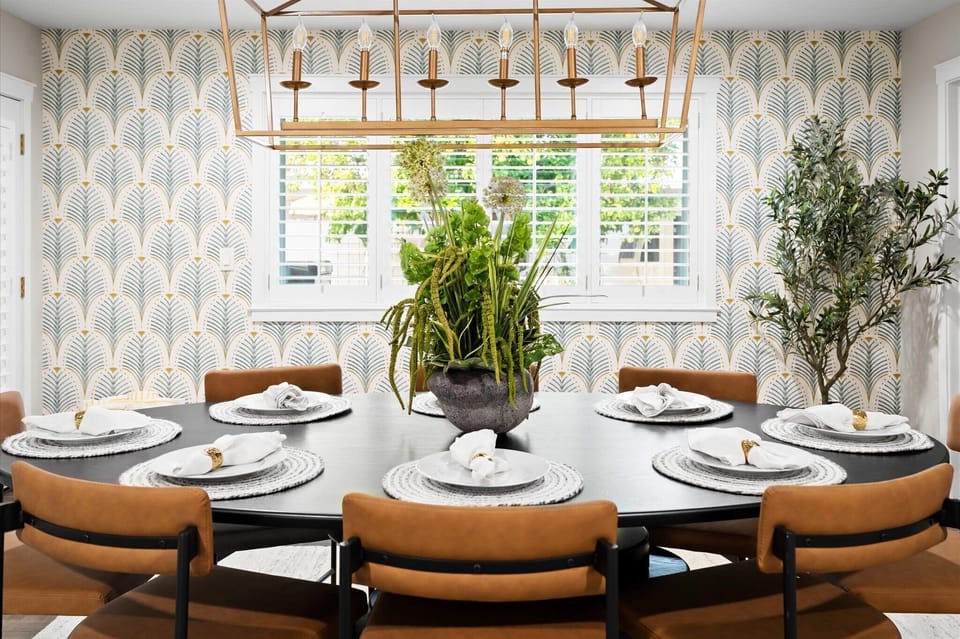Come together around this beautifully styled dining space where shared meals and connection take center stage. The dining table provides seating for 8. There are 5 additional bar stools for seating at the kitchen island. 