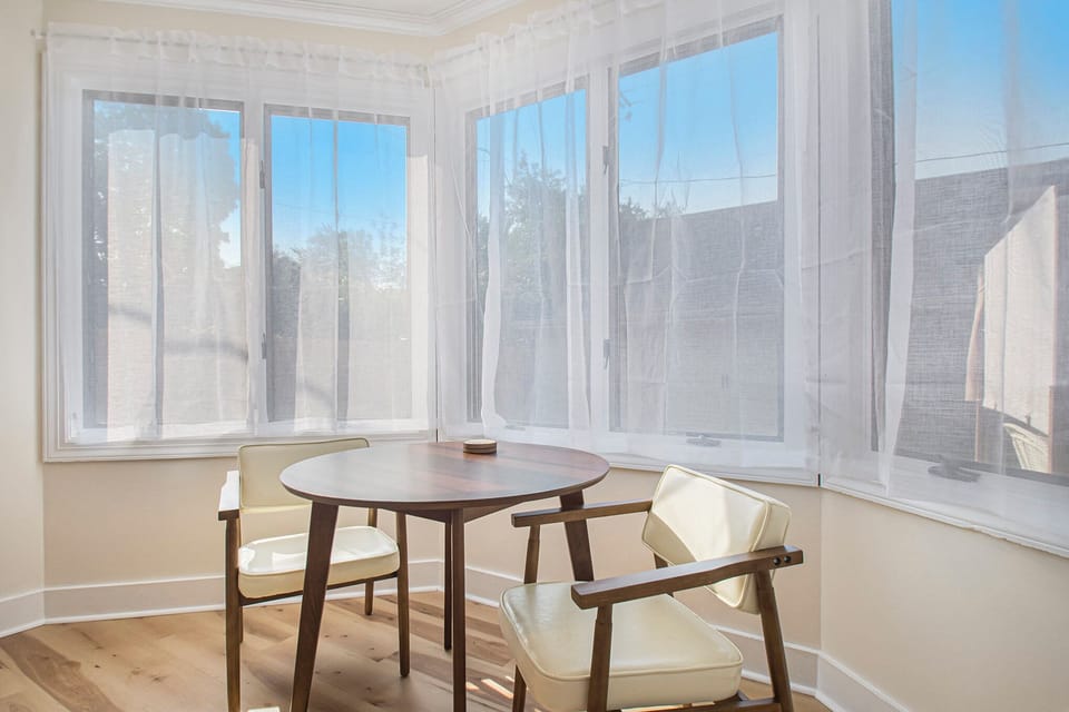 Directly off the kitchen is this sunny breakfast nook & bar counter.