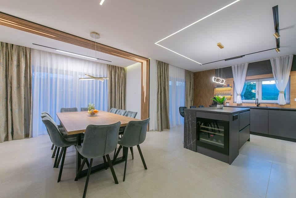 Ground floor living area showing the stylish dining area and fully equipped kitchen.