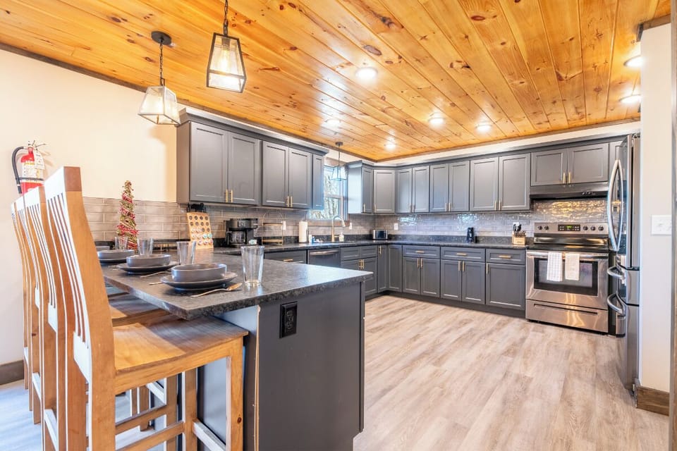 Your spacious kitchen features granite countertops, stainless steel appliances, and warm wood accents that make cooking feel like home.