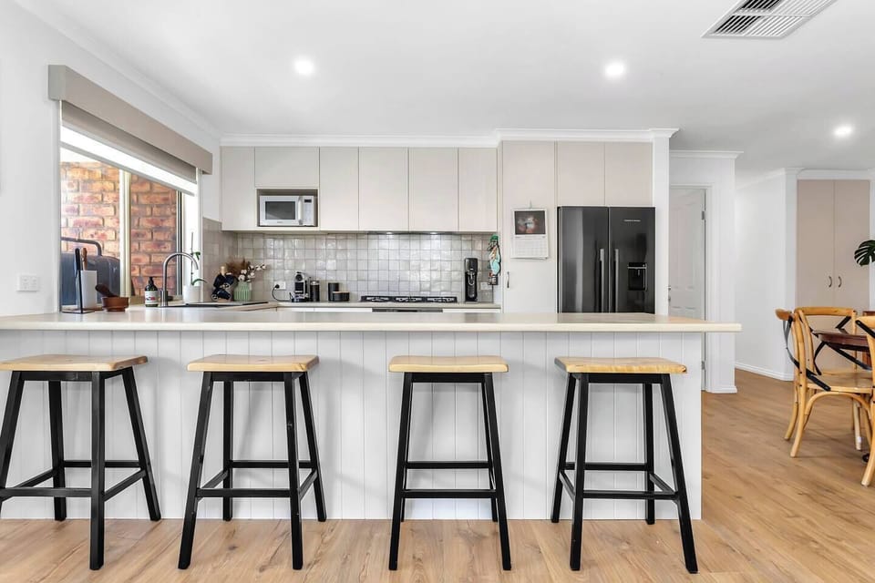 Pull up a stool at the breakfast bar for casual meals, morning coffee, or easy conversation while meals come together.